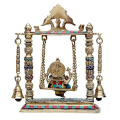 Brass Ganesha swing statue with back-turned figure, circular halo detail, hanging chains