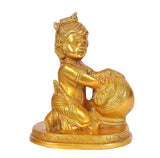Brass Bal Krishna figurine close-up, seated pose, gold tone, detailed crown.