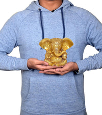 Brass Ganesha idol statue in hands for scale, 5 inch height