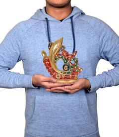 Brass Ganesha idol held in hands, red-green-blue jeweled enamel on gold base