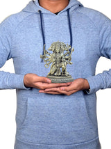 Brass Panchmukhi Hanuman idol held in hands on a blue hoodie chest