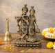 Brass Radha Krishna idol statue standing together, Krishna playing flute beside peacock