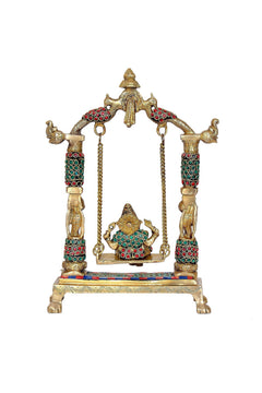 Brass Ganesha jhula, central Ganesha figure with arched top, chains, and tiled base