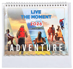 Close-up 2026 desk calendar cover: “Live the Moment” adventure title and explorers