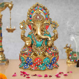 Ganesha brass idol with multicolor beaded crown, teal red blue patterns