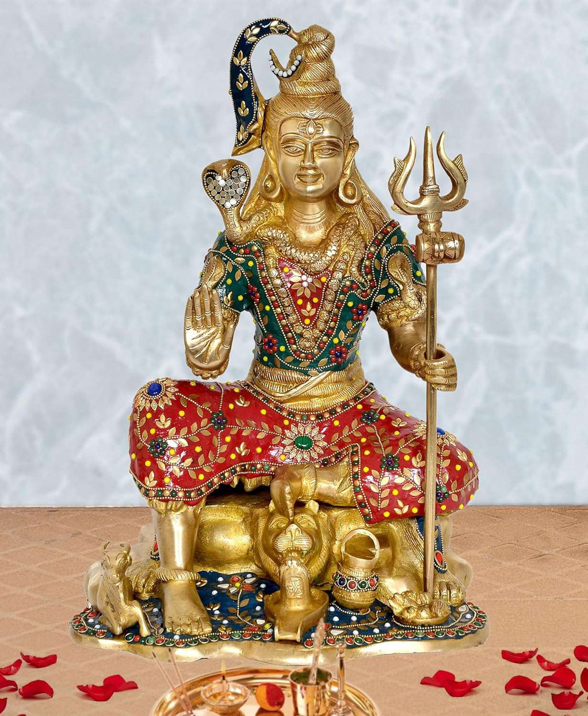 Brass Shiva seated statue with trident, gold tone, red and green painted details