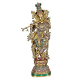 Brass Krishna statue with flute, crown and halo, front view with detailed ornamentation