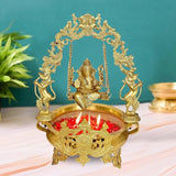 Brass Ganesha swing urli showpiece with hanging chains, seated deity, and ornate tray