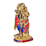 Brass Radha Krishna idol showing embracing figures, detailed gold and jeweled trim