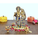 Brass Radha Krishna idol with jeweled crowns, standing together on base.