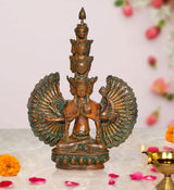 Brass Avalokiteshvara idol with eleven heads and two large fan-like arms