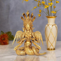 Brass Naga Kanya statue, seated goddess with ornate crown, wing details, and coiled serpent