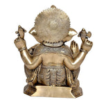 Brass Ganesha statue idol, rear view with patterned back drape and raised arms