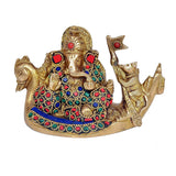 Brass Ganesha sitting on swan palki, red blue green bead accents on dress