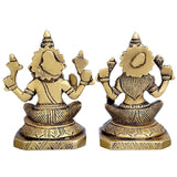 Brass deity idol statue (rear view): seated figures with raised arms on round base