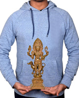 Blue hoodie with brass Kal Bhairava idol print; hands holding the small statue