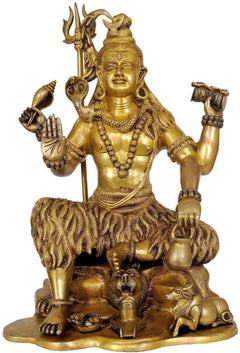 Brass Yogeshvara Shiva figure with trident, seated, ornate animals base