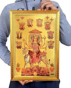 Framed Durga and tiger foil poster held in hands, ornate gold border