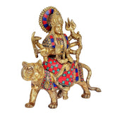 Brass Durga statue on lion, front view with halo disc and raised trident