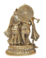 Brass Radha Krishna idol statue, back view with large circular halo and draped garments