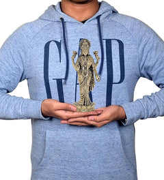 Hands holding a small 7-inch brass Lakshmi Laxmi standing idol for home temple
