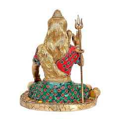 Brass Lord Shiva back view, long hair and red-green patterned robe; trident behind