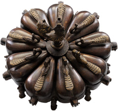 Brass peacock ritual box lid: radial teardrop lids around center medallion, top view