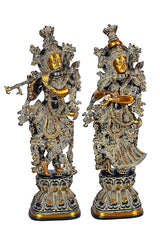 Brass Radha Krishna idol pair in black finish, detailed armor-style outfits and crowns