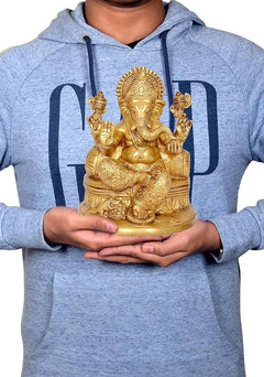 Brass Ganesha statue in hands, 8-inch idol on base for home decor