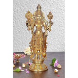 Golden brass Vishnu ji standing idol with four arms, detailed crown and ornaments