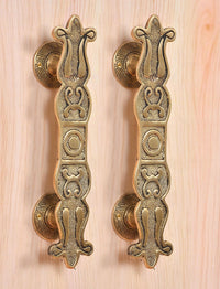 Golden brass door pull handles pair with rosette backplates and embossed floral relief