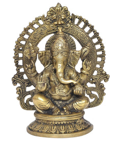 Brass seated Ganesha statue with elaborate arch halo, trunk forward, blessing hands