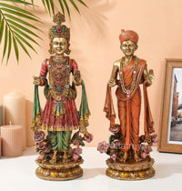 Resin swami idol set, ornate front pose with crown, colorful robes, and floral base