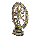 Brass Nataraja Shiva showpiece, side view showing dancing legs and ornate halo ring