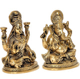 Brass Lakshmi and Ganesha statues, close view of faces, headdresses, and hands