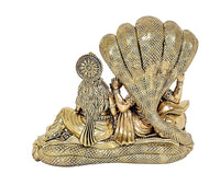 Brass Sheshnag hood behind Lakshmi and Vishnu idol statue, detailed serpent base