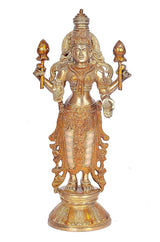 Brass Lakshmi standing statue with ornate crown and raised hands, front view