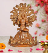 Brass Dakshinamurti Shiva statue, seated figure with ornate halo and raised hands