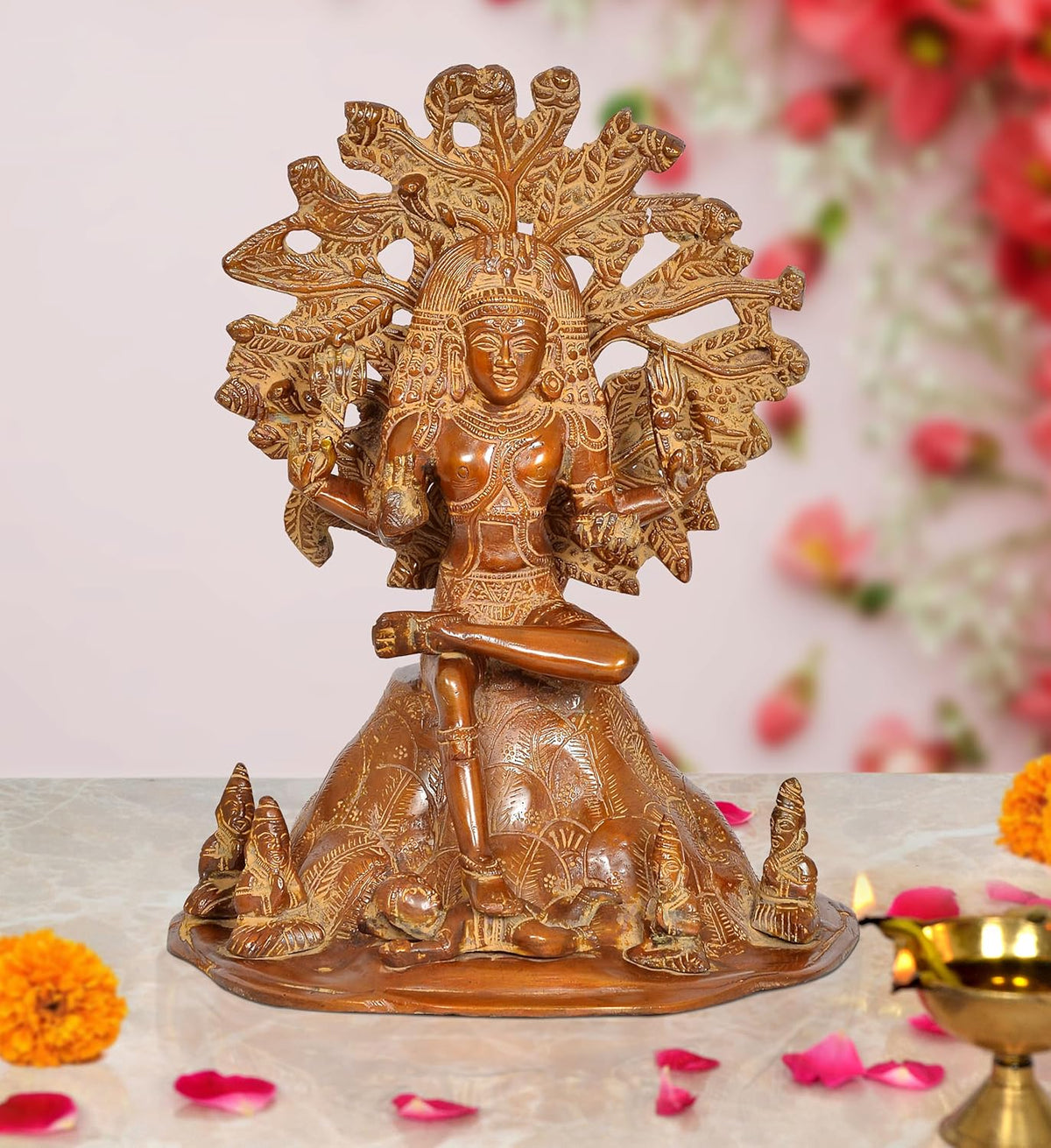 Brass Dakshinamurti Shiva statue, seated figure with ornate halo and raised hands