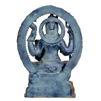 Back view of Shiva sculpture with dark blue torso, circular halo, and gold accents
