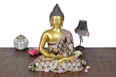 Brass Buddha meditation statue with gold face and patterned robe, seated lotus pose