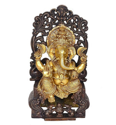 Lord Ganpati statue facing forward, gold detailing on dark decorative throne