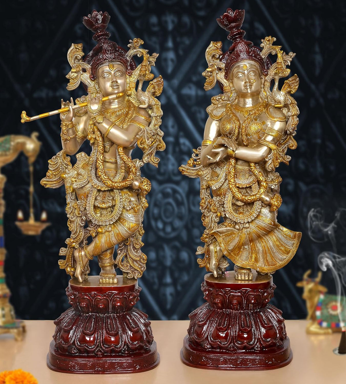 AONA Brass Radha Krishna idol, two standing figures with gold detailing and maroon crowns