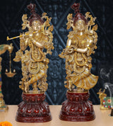AONA Brass Radha Krishna idol, two standing figures with gold detailing and maroon crowns