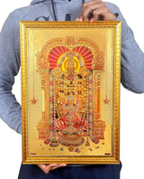 Framed Tirupati Balaji foil wall decor held in hands, gold border and detailed artwork