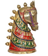 Brass horse ornament in multicolor outfit, side view