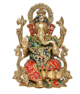 Brass Ganesha statue, seated with red skirt, green-and-blue jeweled details, halo