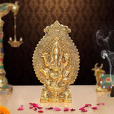 Gold metal Ganesha idol, front view, ornate embossed details