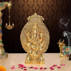 Gold metal Ganesha idol, front view, ornate embossed details