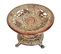 Ornate brass fruit tray close-up with horse-and-floral etched detailing